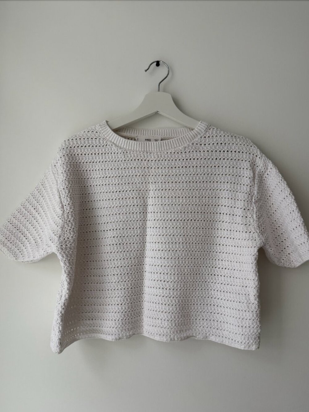 Knitted sweater with openwork details